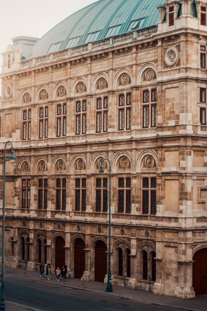 Elegant facade of the Vienna State Opera House captured in a classic vertical shot, Austria.